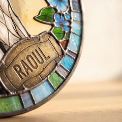 Stained glass and engraved name detail