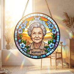 Memorial suncatcher hanging in a sunlit window
